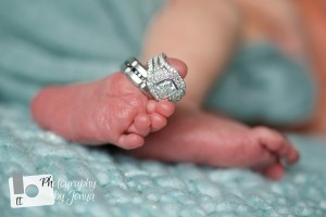 newborn photography with feet and wedding rings