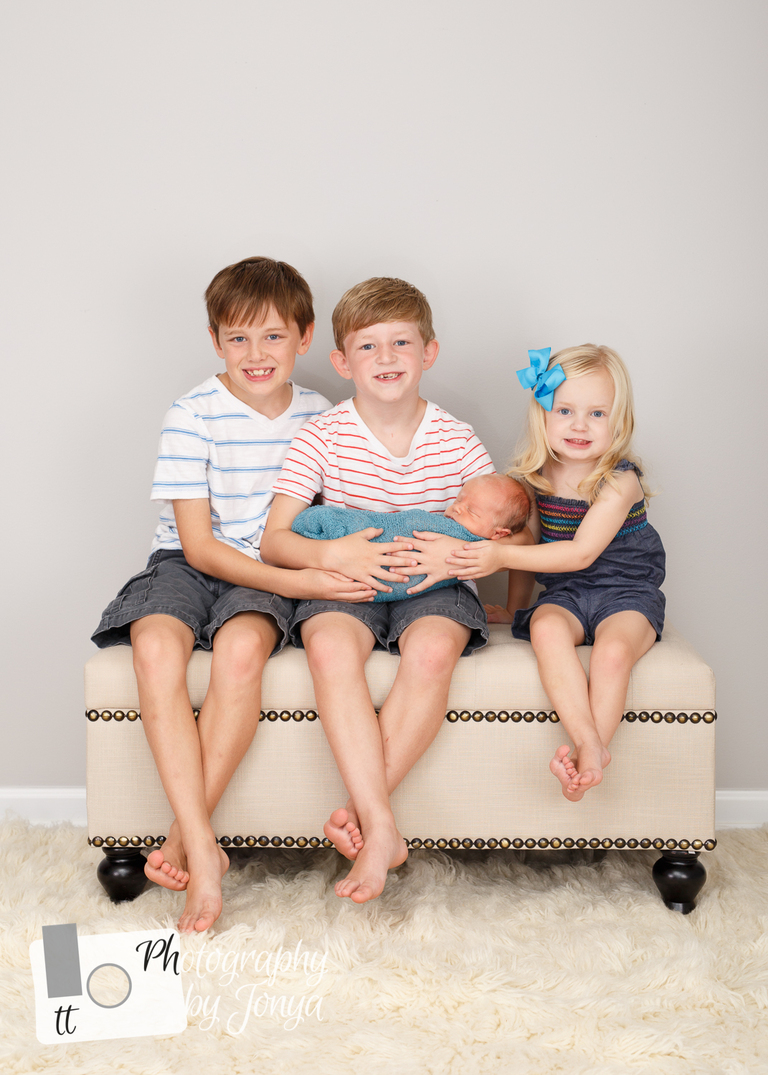 Newborn photography with siblings in Raleigh NC
