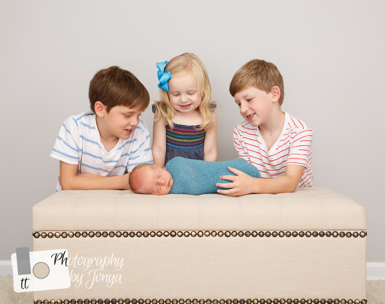 Sibling photography during a newborn photography session in Raleigh NC